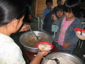 Hot lunch is served to children